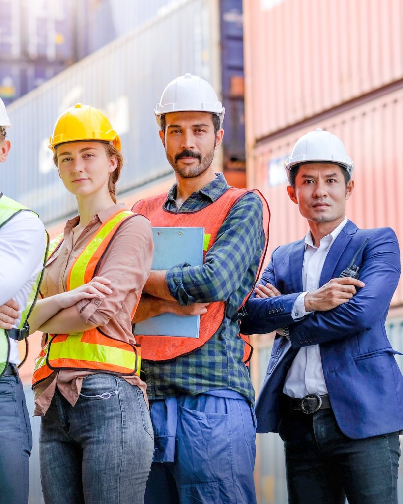 Group of technician or engineer worker stand with confident action or fold arms in cargo